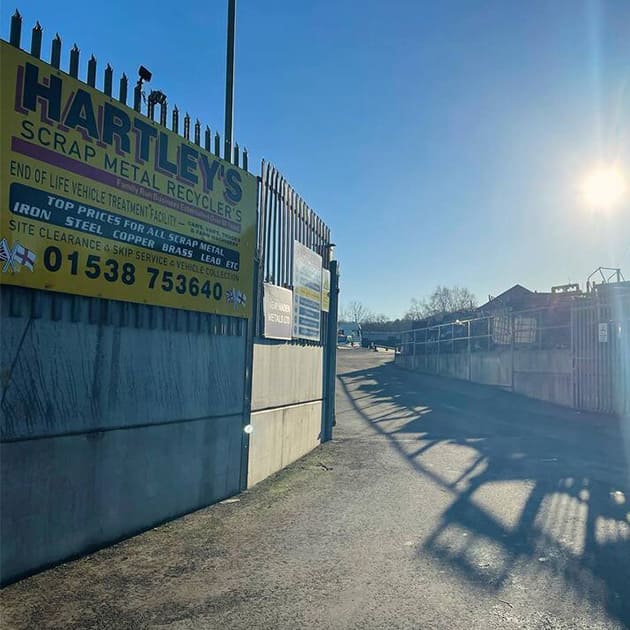 scrap metal recycling yard on a sunny day